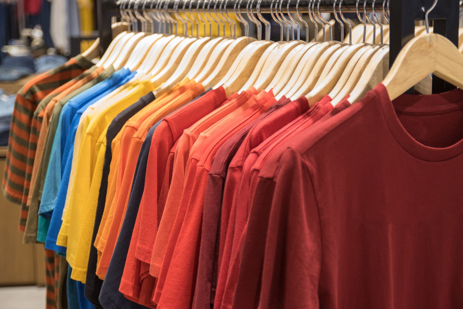 Orange/red t-shirts on hangers